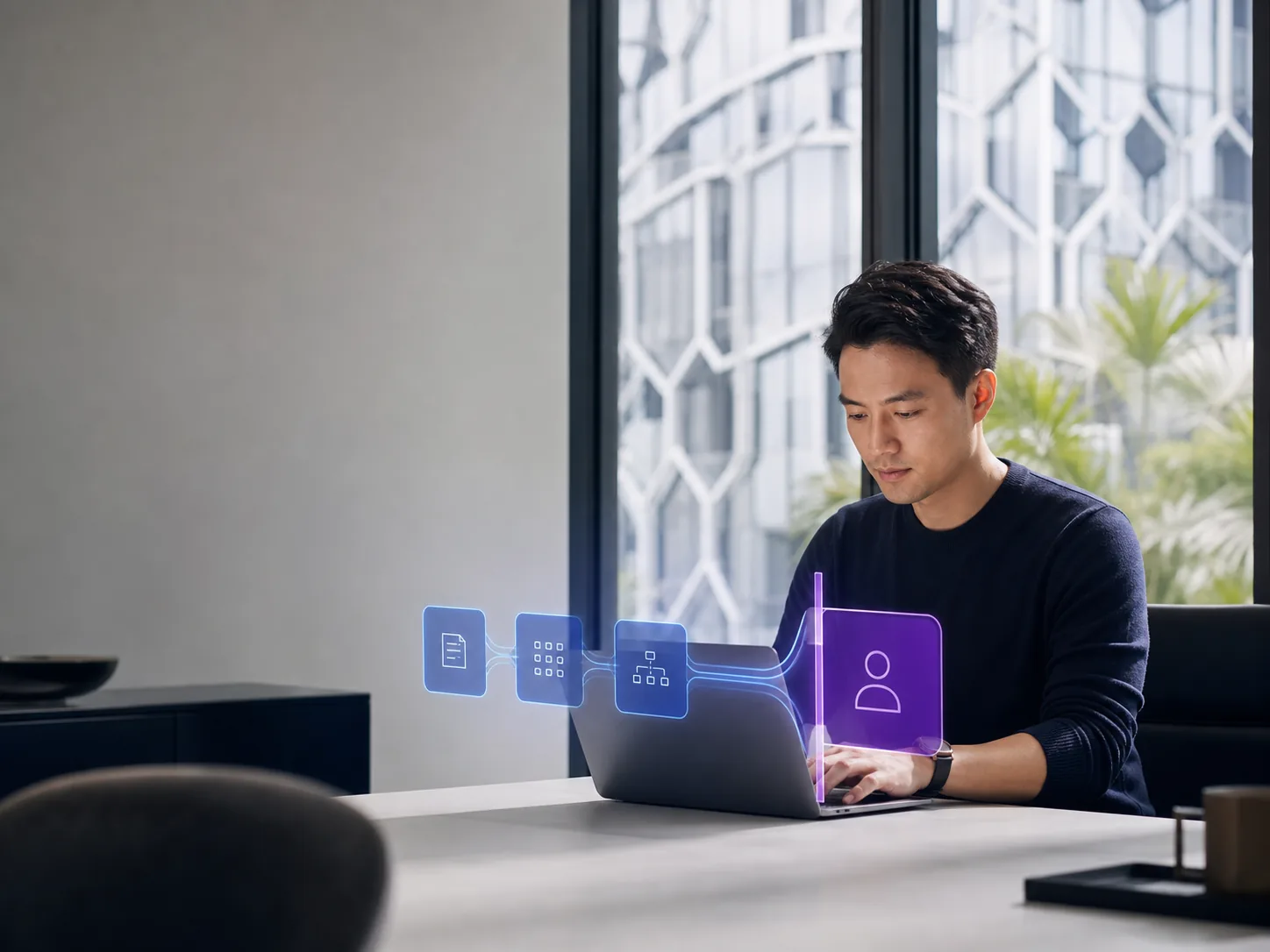 Founder using a laptop beside an illustrative workflow that stops at an external review boundary.